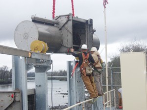 Installing one of the screen units onto the track and docking inlet.